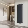 A modern interior with a vertical radiator mounted on a wall. Anteprima dell’immagine prodotto