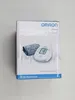 The image shows the retail packaging of an Omron blood pressure monitor. Náhľad obrázku produktu