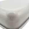 A close-up view of a corner of a gray cat litter box with a rounded corner. Produktbild-Vorschau