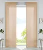 Two beige panel curtains are shown hanging in front of a window with a view of trees and sky. Produktbild-Vorschau