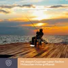 A person fishing on a pier at sunset, with a small organizer box on the pier. Voir les images du produit