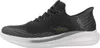 A side view of a single black athletic shoe. Anteprima dell’immagine prodotto