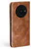 A close-up side view of a brown leather flip phone case for a Xiaomi Redmi A3. Produktbild-Vorschau