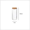A clear product shot of a cotton pad dispenser with a bamboo lid. Anteprima dell’immagine prodotto