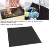 Collage showing a black silicone mat being cleaned and a separate image of the mat itself. Produktbild-Vorschau