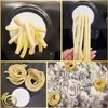 A collage of images showing pasta being made and finished products. Produktbild-Vorschau