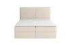 A front view of a beige upholstered boxspring bed with a white mattress topper, set against a white background. Produktbild-Vorschau