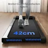 A person is walking on a treadmill in a home setting. Anteprima dell’immagine prodotto