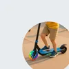 A child riding a blue electric scooter with colorful lights on the wheel. Anteprima dell’immagine prodotto