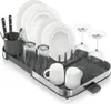 A dish drying rack filled with dishes, glasses, and mugs. Voir les images du produit