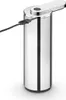 A close-up, studio shot of a sleek, metallic soap dispenser with a charging cable attached. Voir les images du produit