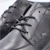 A close-up shot of black leather shoes. Podgląd zdjęcia produktu