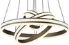 A modern chandelier with multiple intertwined rings, illuminated by LED lights. Produktbild-Vorschau