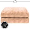 Two stacked beige corduroy blankets on a white background. Anteprima dell’immagine prodotto