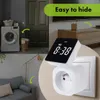 A digital timer plugged into a wall socket, with a split image showing a laundry room and a living room. Náhľad obrázku produktu