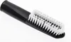 A close-up product shot of a black and white brush. Produktbild-Vorschau