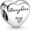 A silver heart-shaped charm with the word "Daughter" engraved on it and a small pink gemstone. Podgląd zdjęcia produktu