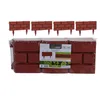 A package of four brick-patterned garden border fences, with a clear plastic wrapper and a product label. Náhľad obrázku produktu