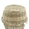 A close-up view of the top of a woven rattan Christmas tree stand cover. Produktbild-Vorschau