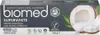 The image shows the front packaging of BIOMED SUPERWHITE toothpaste, featuring a cut coconut and green leaves. Anteprima dell’immagine prodotto
