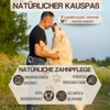 A man and a dog interacting outdoors. Produktbild-Vorschau