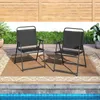 Two black folding chairs are placed on a brown rug next to a swimming pool. Náhľad obrázku produktu