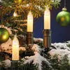 Christmas tree decorations with lights and ornaments. Produktbild-Vorschau