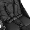 Close-up view of a black stroller seat with a five-point harness. Náhľad obrázku produktu