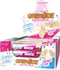 A box of Grenade Birthday Cake protein bars, with some bars shown outside the box. Produktbild-Vorschau
