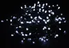 A tangled pile of white LED string lights on a black background. Produktbild-Vorschau