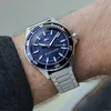 A close-up shot of a Tommy Hilfiger watch on a person's wrist. Anteprima dell’immagine prodotto