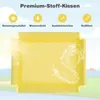 A yellow fabric product is shown with water splashing on it, set against a background of a sunny sky and a golf course. Náhľad obrázku produktu