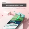 A light blue mini power bank is shown attached to a smartphone that is charging. Produktbild-Vorschau