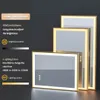Three illuminated mirrors of different sizes are displayed against a dark background, with text overlays describing features. Náhled obrázku produktu