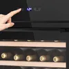 A hand is shown pressing a button on a wine cooler, with shelves of wine bottles visible below. Produktbild-Vorschau