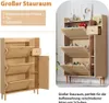 A shoe cabinet with multiple compartments and a drawer, shown in an interior setting. Podgląd zdjęcia produktu