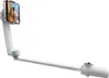 A white selfie stick with a phone attached, showing a couple taking a photo. Podgląd zdjęcia produktu