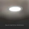 A round LED downlight is installed on a ceiling, with text overlay indicating ease of installation and low maintenance. Podgląd zdjęcia produktu