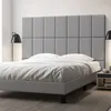 A bedroom scene with a bed and headboard. Náhľad obrázku produktu