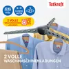 A drying rack with shirts hanging on it. Voir les images du produit