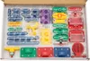 A set of electronic components for learning and building circuits, laid out in a cardboard box. Anteprima dell’immagine prodotto
