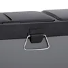A close-up view of a gray trash can with a black lid and a silver handle. Voir les images du produit