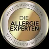 A circular badge with text on it. Produktbild-Vorschau