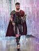 A man dressed in a gladiator costume walks forward against a shimmering, reflective background. Podgląd zdjęcia produktu