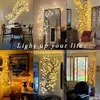 A collage of images showing illuminated willow branches used as decorative lighting in various home settings. Produktbild-Vorschau