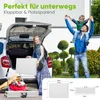 A family is loading a foldable table into the trunk of a car, suggesting portability and ease of use for outdoor activities. The image also includes a diagram showing the dimensions of the table. Produktbild-Vorschau
