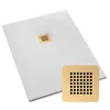 A white shower tray with a gold drain cover, shown from a diagonal angle. A close-up of the drain cover is also shown. Produktbild-Vorschau