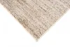 A close-up view of a corner of a rug with a textured, speckled pattern. Náhľad obrázku produktu