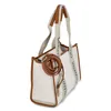 A white tote bag with brown trim and straps, featuring the brand name printed on the straps. Anteprima dell’immagine prodotto