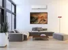 A modern living room with a sectional sofa, coffee table, and artwork on the wall. Anteprima dell’immagine prodotto